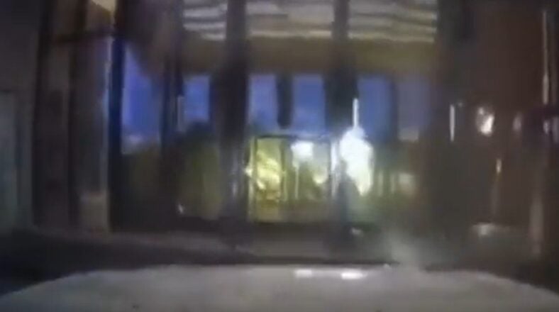 Damaged mall entrance after a man drove into it following a breakup