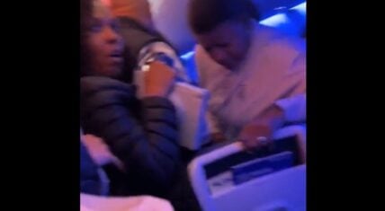 Man opens airplane door and jumps on wing forcing landing