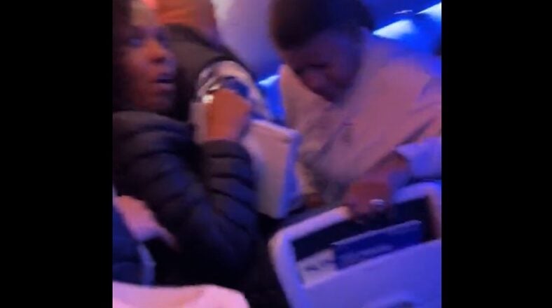 Man opens airplane door and jumps on wing forcing landing