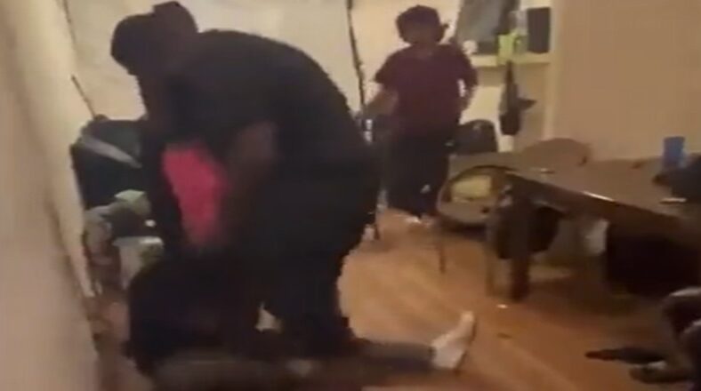 Son confronts and beats mother's abusive boyfriend in public room