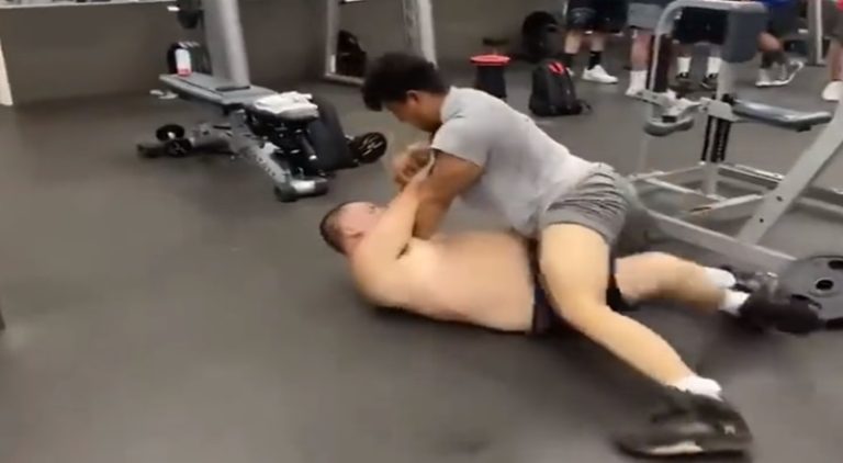 Two out of shape men get into a fight at the gym