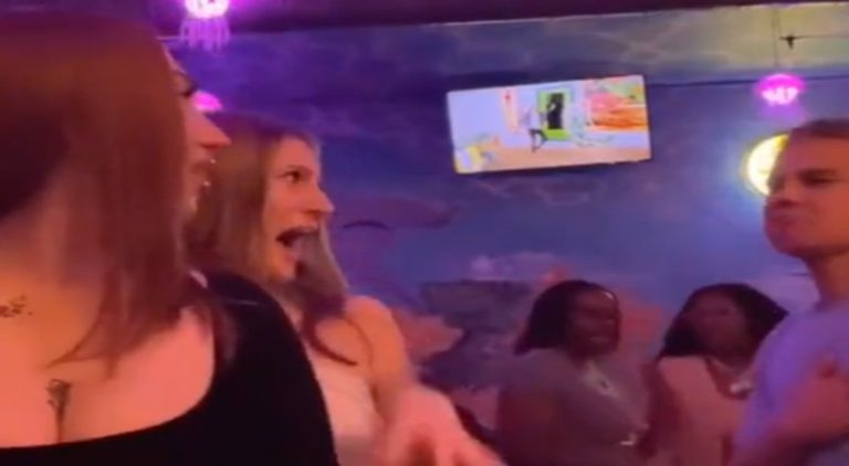 Woman screams in fear after seeing guy dancing behind her