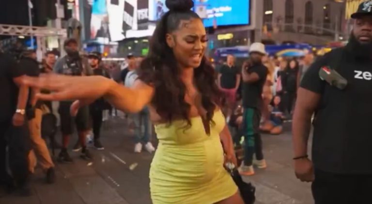Camilla Poindexter dances in the middle of Times Square