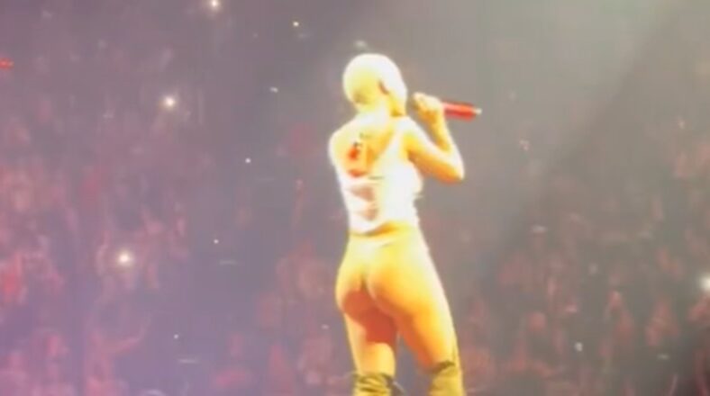 Doja Cat pokes her back side out during performance