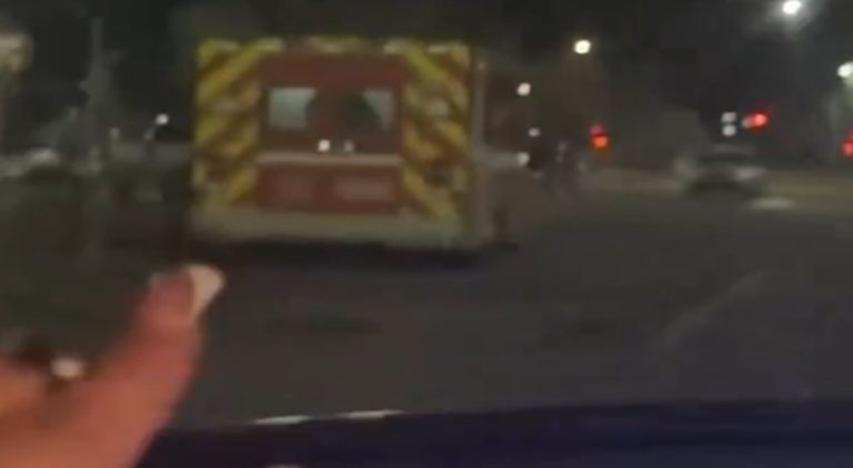 Woman spots paramedics getting busy in parked ambulance