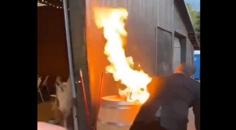 Drunk man puts a fire out at a wedding by dancing on it