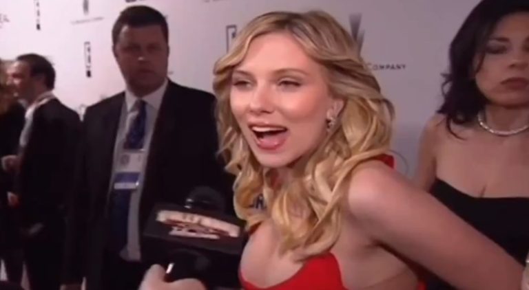 Woman disappears behind Scarlett Johansson on red carpet