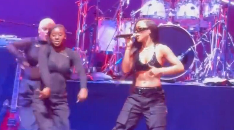 Serayah dressed as Aaliyah, performing "Are You That Somebody" at Essence Festival with backup dancers.