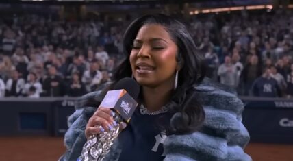 Ashanti performs the national anthem at Yankee Stadium during Game 4 of the World Series between the Yankees and Dodgers.
