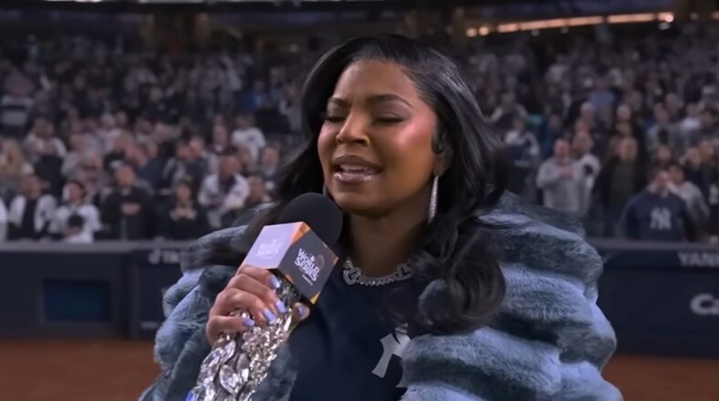 Ashanti performs the national anthem at Yankee Stadium during Game 4 of the World Series between the Yankees and Dodgers.