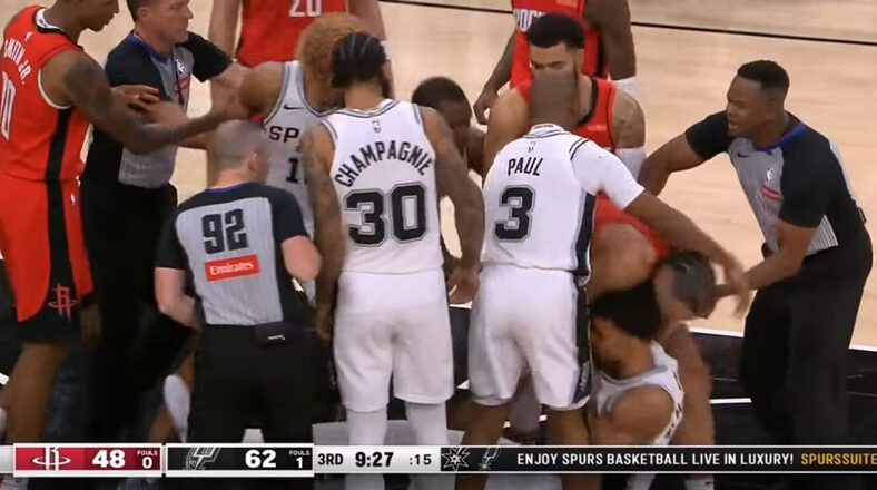 Dillon Brooks and Victor Wembanyama in a heated fight on the court during Spurs vs. Rockets game