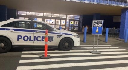 Police car parked outside a Walmart after a 19-year-old employee was found dead in the bakery oven