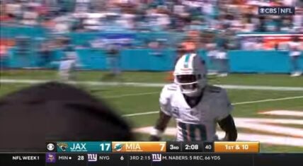 Tyreek Hill celebrates a touchdown during a Dolphins game.