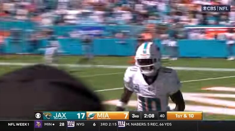 Tyreek Hill celebrates a touchdown during a Dolphins game.