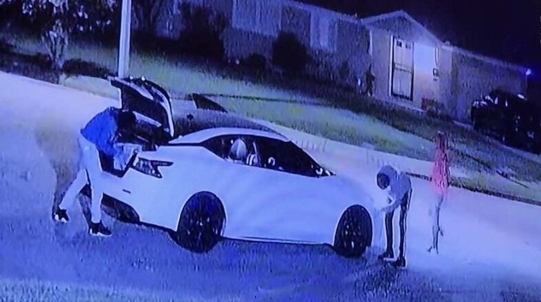 Surveillance footage of masked individuals stealing a 2019 Nissan Maxima