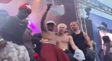 During WizKid's performance at the AIA Festival, in Denmark, an excited fan wrapped his arm around his waist while he performed. As a result, WizKid's security came and calmly removed the man's hand from WizKid.