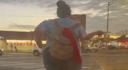 This woman crossing the street while singing and dancing to music on her earbuds has led to hundreds upon thousands of people offering their opinions on the situation.