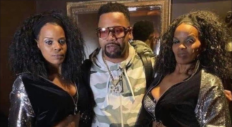 Juvenile received a lot of attention for the two women he took this photo with. While the fans have jokes, these ladies are actually the Ghetto Twiinz, a legendary rap duo from New Orleans.