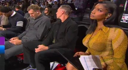 Taylor Rooks was simply sitting courtside, during the Thunder-Spurs game. Steve Nash playfully thumped Dirk Nowitzki's ear. However, the focus was on Taylor Rooks in that gold, yellow dress.
