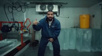 Drake poses in a blue jumpsuit inside an icy industrial freezer for his ICEMAN album rollout. The cold-themed visual perfectly matches the title of his new 2026 project.