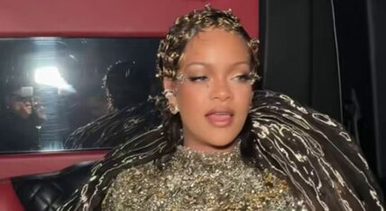 Rihanna dazzles in her jeweled Met Gala gown with dramatic shoulder accents and ornate headpiece. The Fenty icon exudes regal glamour and star power.