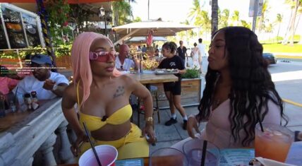 Yung Miami with pink hair in yellow bikini reveals Diddy sent her $2.3 million in one day as Jordyn Lucas reacts with surprise during outdoor Miami stream.
