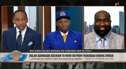 First Take panel with Stephen A. Smith (left), Cam'ron in blue suit and Knicks hat (center), and Kendrick Perkins (right) discussing whether James Dolan’s message on firing Tom Thibodeau was fair or foul, following the Knicks’ 2026 NBA championship.
