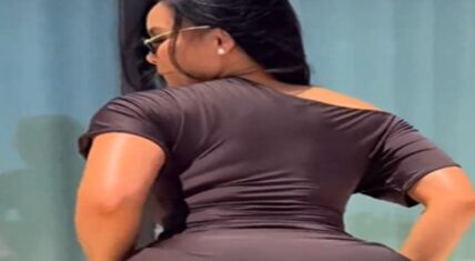 Daphne Joy dances from behind in a tight dark dress, arching her back during her viral Instagram Reel set to Drake and Popcaan’s “Amazing Shape” following the Diddy tape leak.