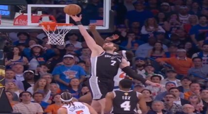 Luke Kornet (#7, San Antonio Spurs) contests Jose Alvarado's floater near the rim as Mitchell Robinson and De'Aaron Fox look on during the controversial no-goaltend play in 2026 NBA Finals Game 4 between the Knicks and Spurs.