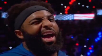 Mitchell Robinson winks directly at the camera while standing during the national anthem before Game 2 of the 2026 NBA Finals.