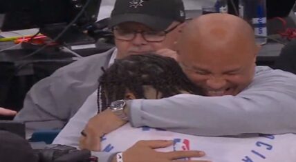 Rick Brunson hugging his son, Jalen Brunson, moments after he led the New York Knicks to the 2026 NBA title.