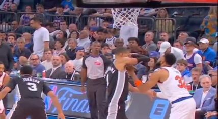 Victor Wembanyama elbows Karl-Anthony Towns in the face during Game 4 of the 2026 NBA Finals between the Spurs and Knicks, with referees watching.