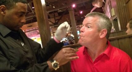 Waiter named Five feeds Lee Bondurant, a man with cerebral palsy, at 42nd Street Oyster Bar in Raleigh, North Carolina, so his mother could eat her meal while it was still hot. The 2016 photo went viral and led to a lasting friendship between them.